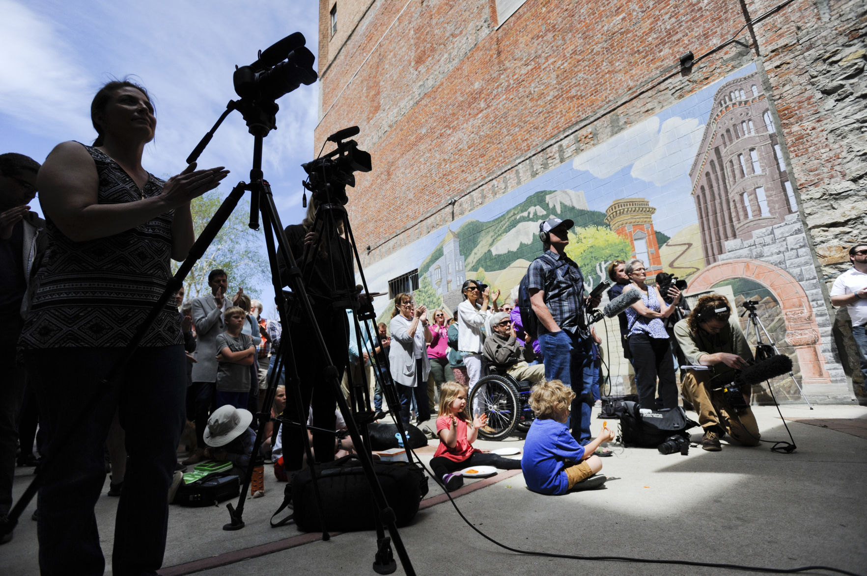 Supporters and members of the press watch Helena Mayor Wilmot Collins announce